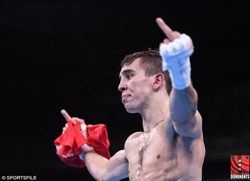Boxer Mick Conlan raises his middle fingers in the direction of the ringside judges to show them what he thinks of this rigged fight.
